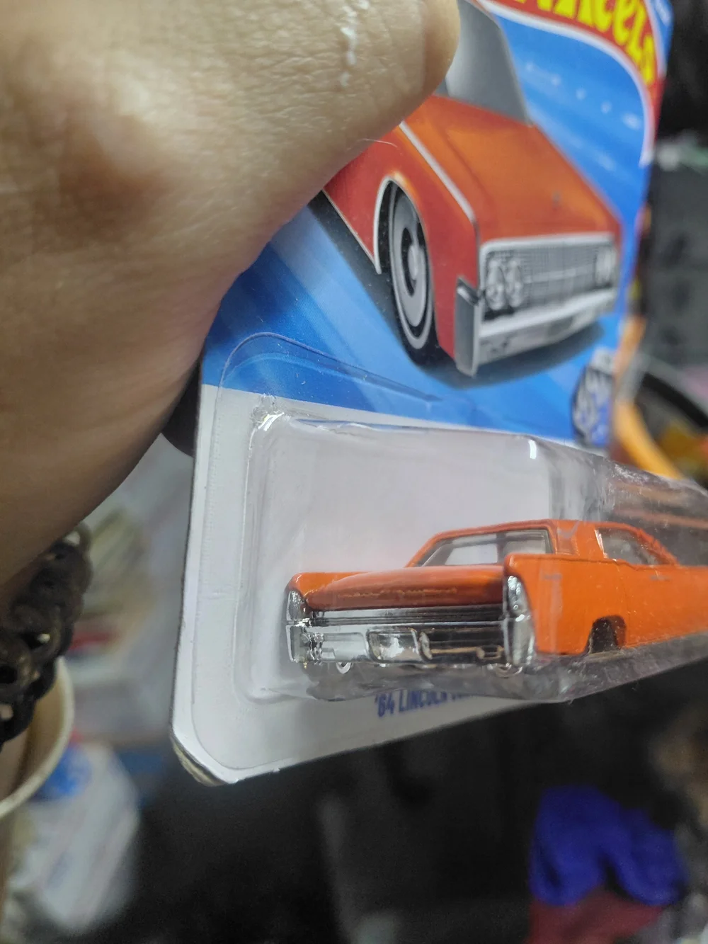 orange Hot Wheels '64 Lincoln Continental from the 2026 mainline series featurin